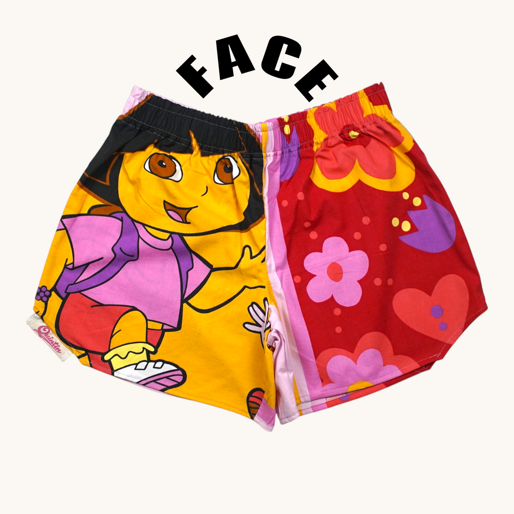 Shorts paracaídas Dora – Algodón reciclado – Talla única (S a L) – Unisex – Colección Cultura Pop – Quintín